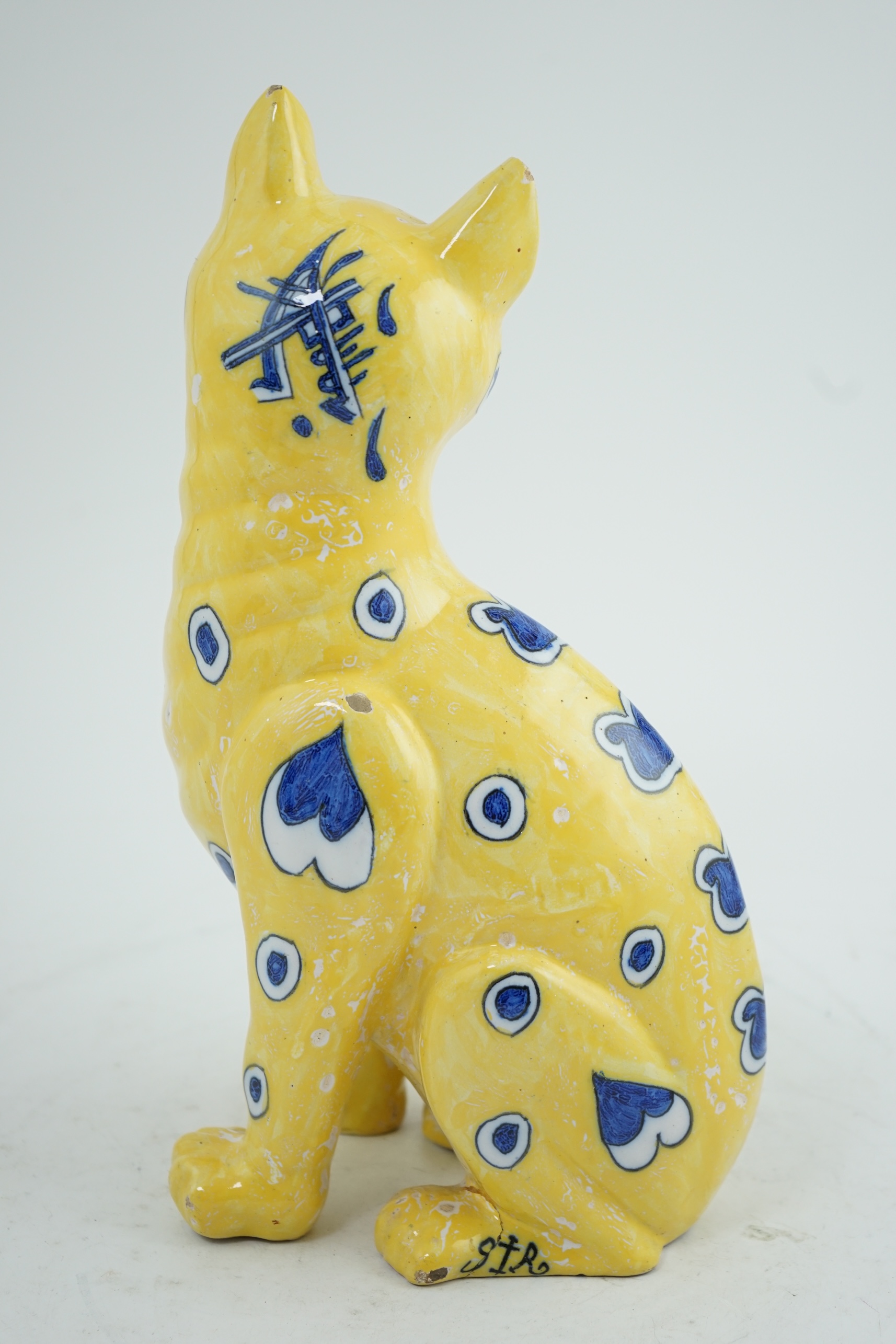 A Gallé yellow faience model of a seated smiling cat, c.1885